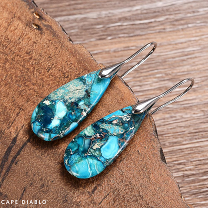 Teardrop earrings to protect ocean energy